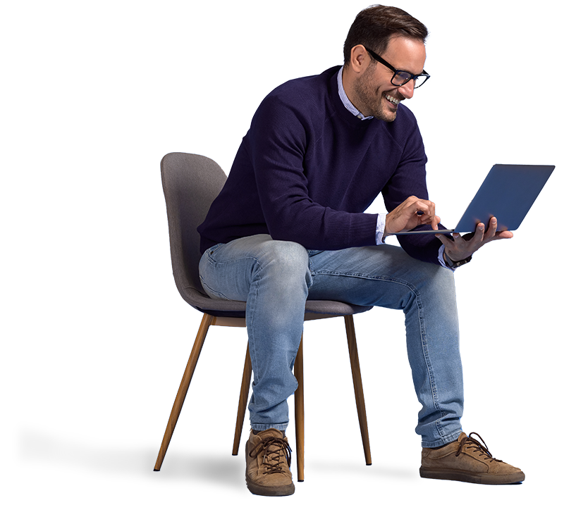 Smiling man sitting and holding a laptop